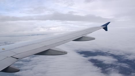 airbus airliner plane wing in flight seen from passenger window