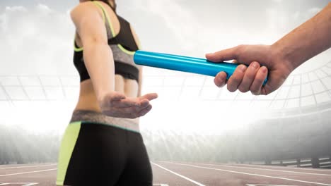 animation of athlete's hands passing relay baton over sports stadium