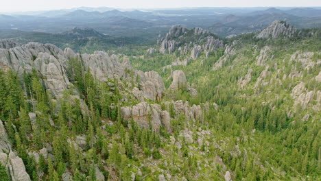 drone shot capturing the raw and untamed beauty of western u.s. rock formations.