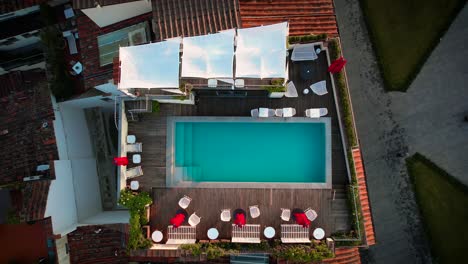 rooftop pool on urban city building - aerial overhead view