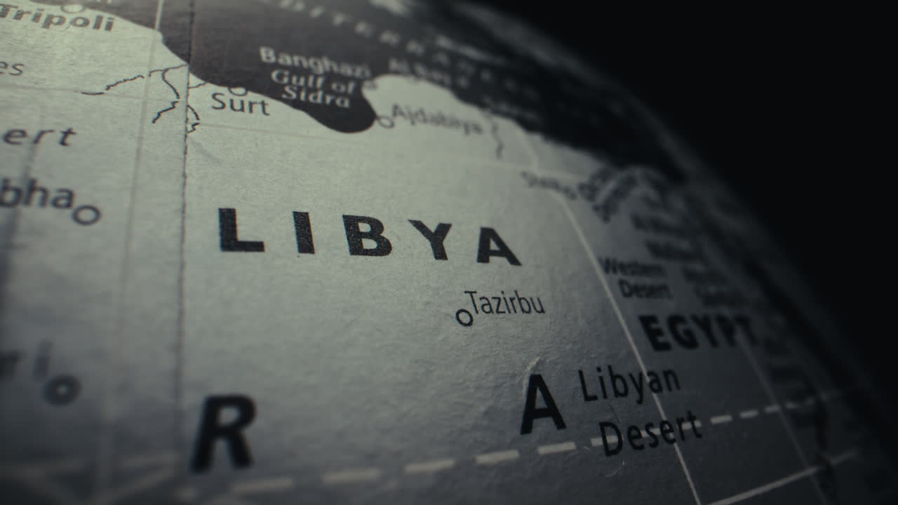 Close-up view of a world globe highlighting Libya and Egypt