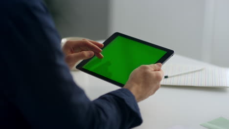 Businessman-hands-touching-tablet-screen.-Man-typing-message-on-padded-cell.