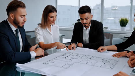 team reviewing building floor plan
