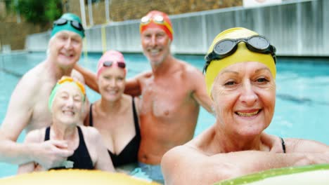 Senior-citizens-smiling-in-swimming-pool