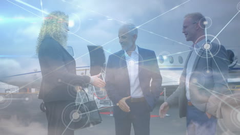 animation of network of connections over business people at the airport
