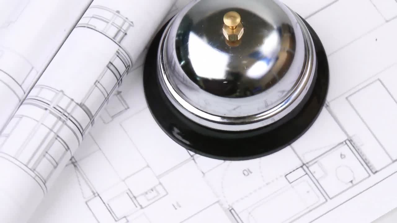 High view of blueprints and service bell turning