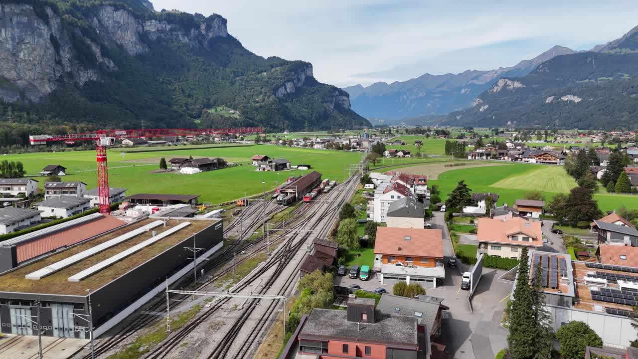 Aerial View of a Train Station in a Mountainous Valley