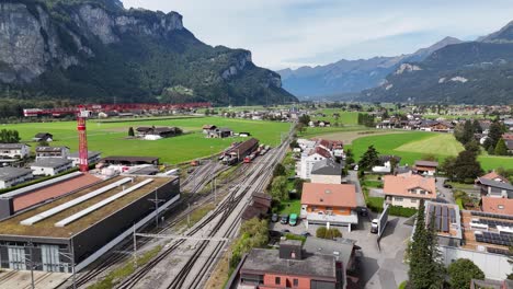 aerial view of a train station in a mountainous valley