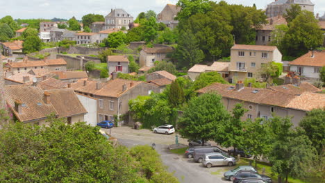 high angle shot of parthenay town with tiled roofs in parthenay, france. old medieval town.