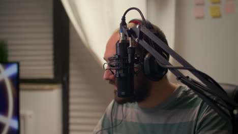 close-up of streamer man talking into microphone