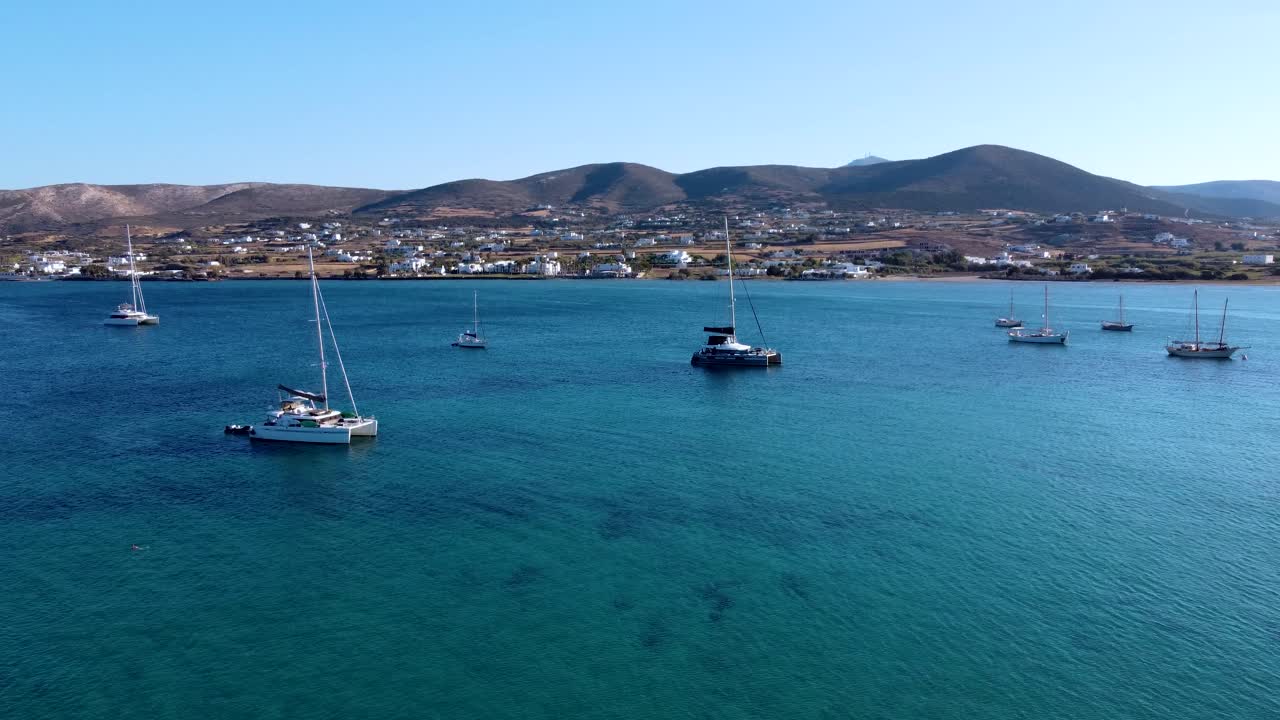 Aerial Orbit of Anchored Catamarans and Sailing Boats in Paros Bay