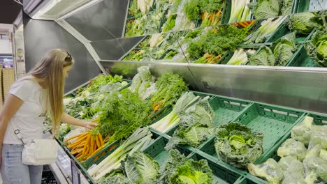 a young indian woman buying vegetables at the local farmers market for stocking vegetables and other essentials before curfew time in the second wave lockdown in india