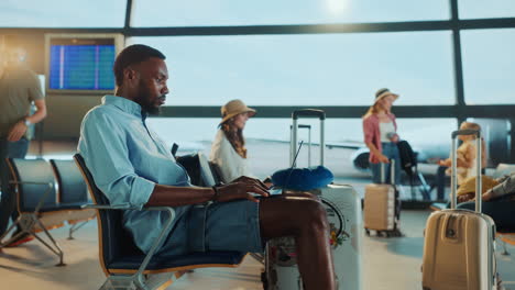 people waiting at the airport terminal