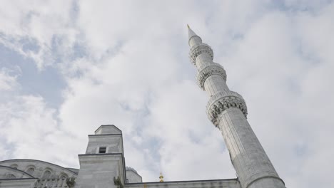 minaret of a mosque against a cloudy sky