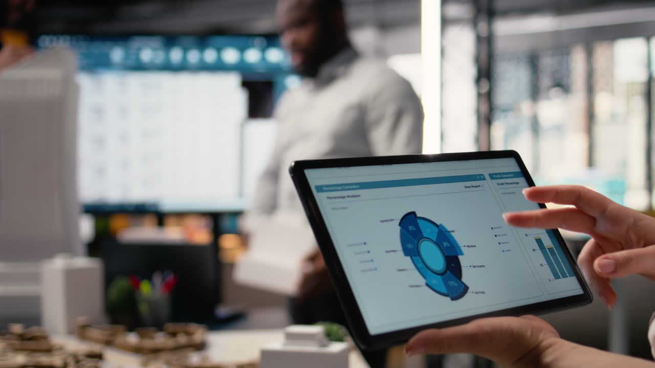 Woman property engineer searching layout details on laptop in the office