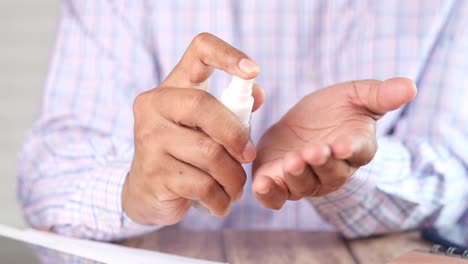 person applying hand sanitizer