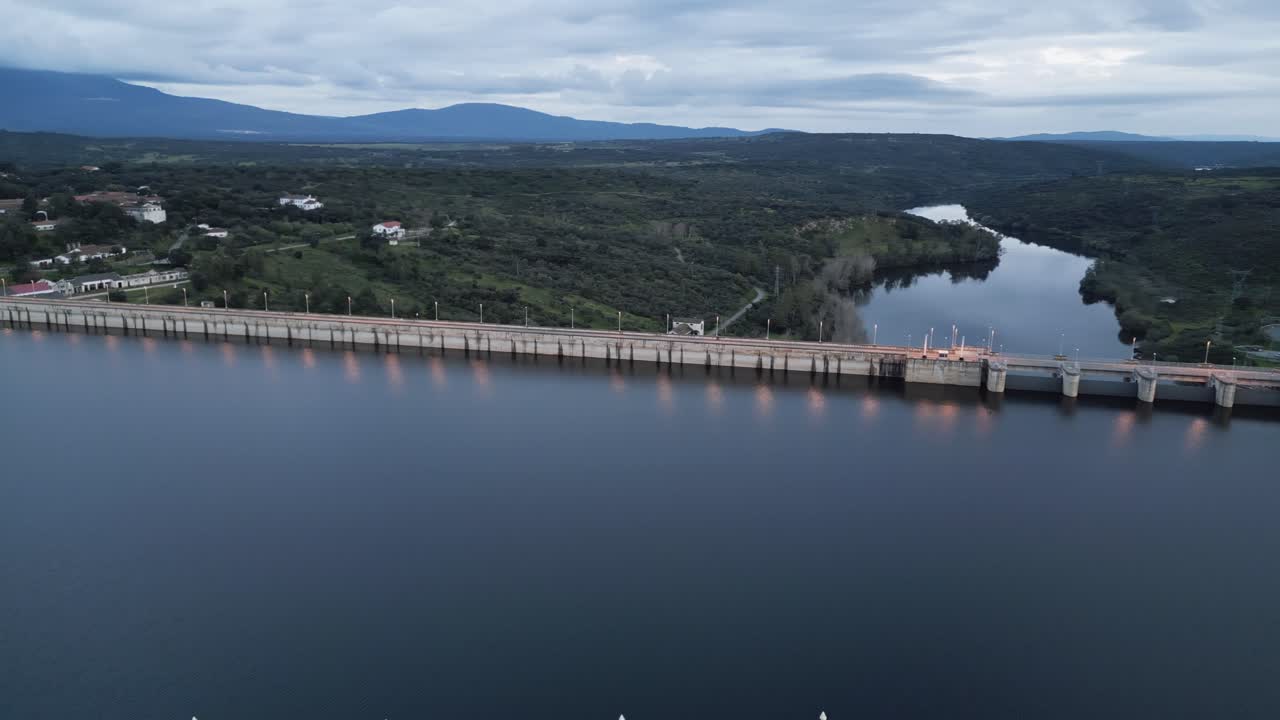 Aerial footage of a reservoir and dam in Cáceres, Extremadura, during sunset