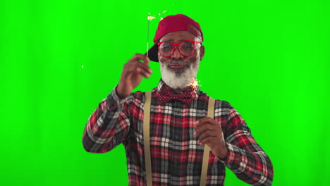 Senior-man,-sparkler-and-green-screen-for-holiday