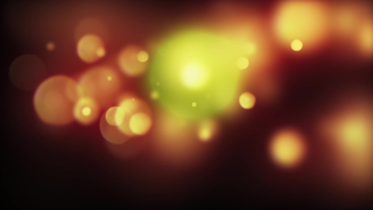 Luci Bokeh Calde Fluttuanti e Scintillanti su Sfondo Scuro