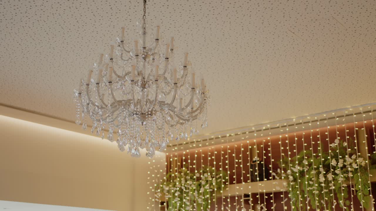 Elegant Crystal Chandelier and Fairy Lights Wedding Decoration