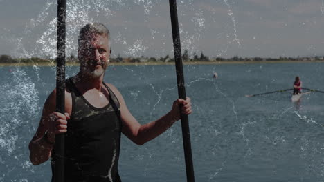 man standing shore lake while holding paddles, health tracker displaying animated heart icons