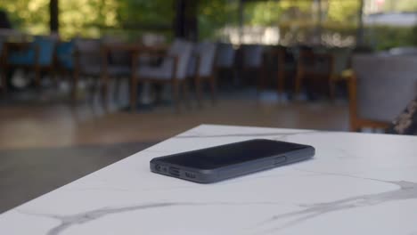 smartphone on table in a cafe