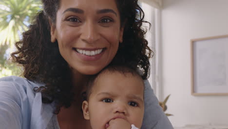 happy mother and baby having video chat using smartphone mom sharing motherhood lifestyle holding toddler enjoying mobile phone communication with family at home