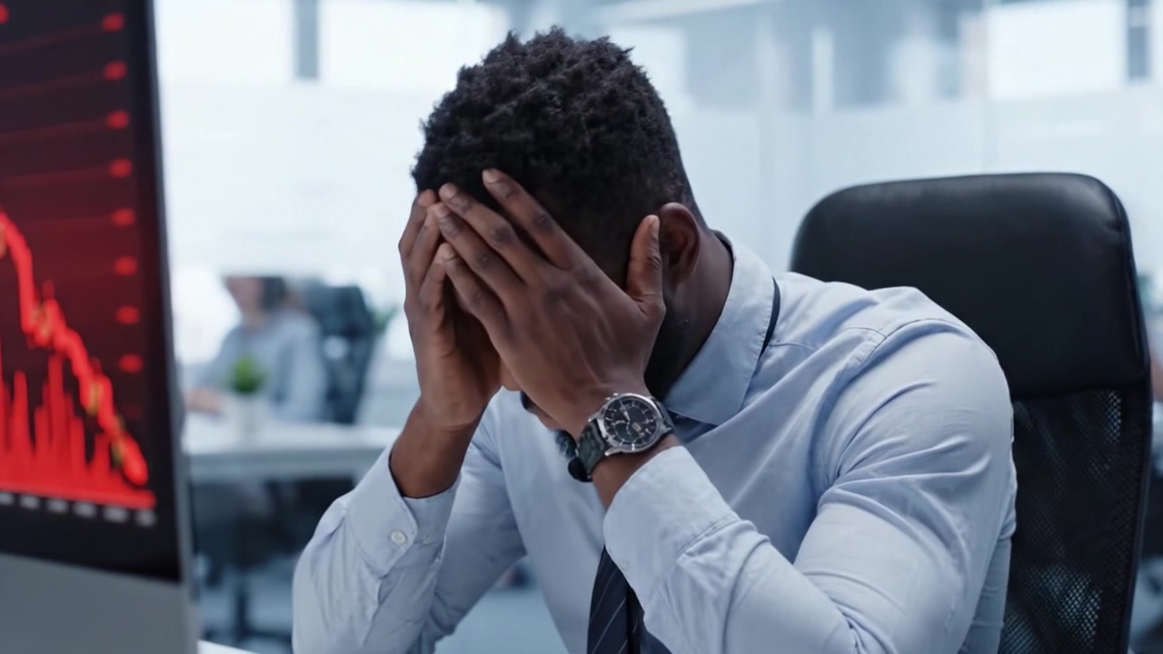 A Financial Analyst's Emotional Journey: From Analysis to Despair as He Faces the Reality of Market Downturns in a Fast-Paced Office Environment