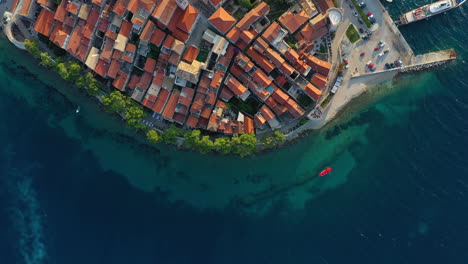 boat touring korčula croatian old town tourist destination, aerial top down view