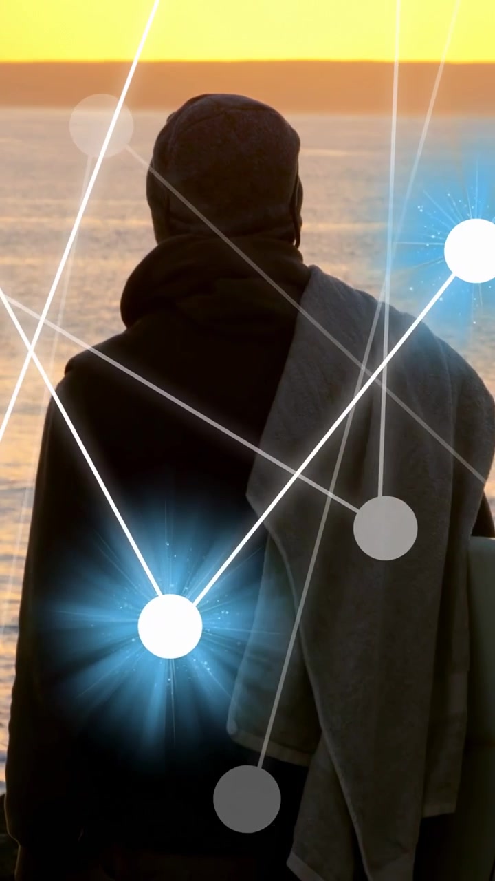 Vertical video: Man facing ocean, frames advancing and tech nodes appearing over back for design