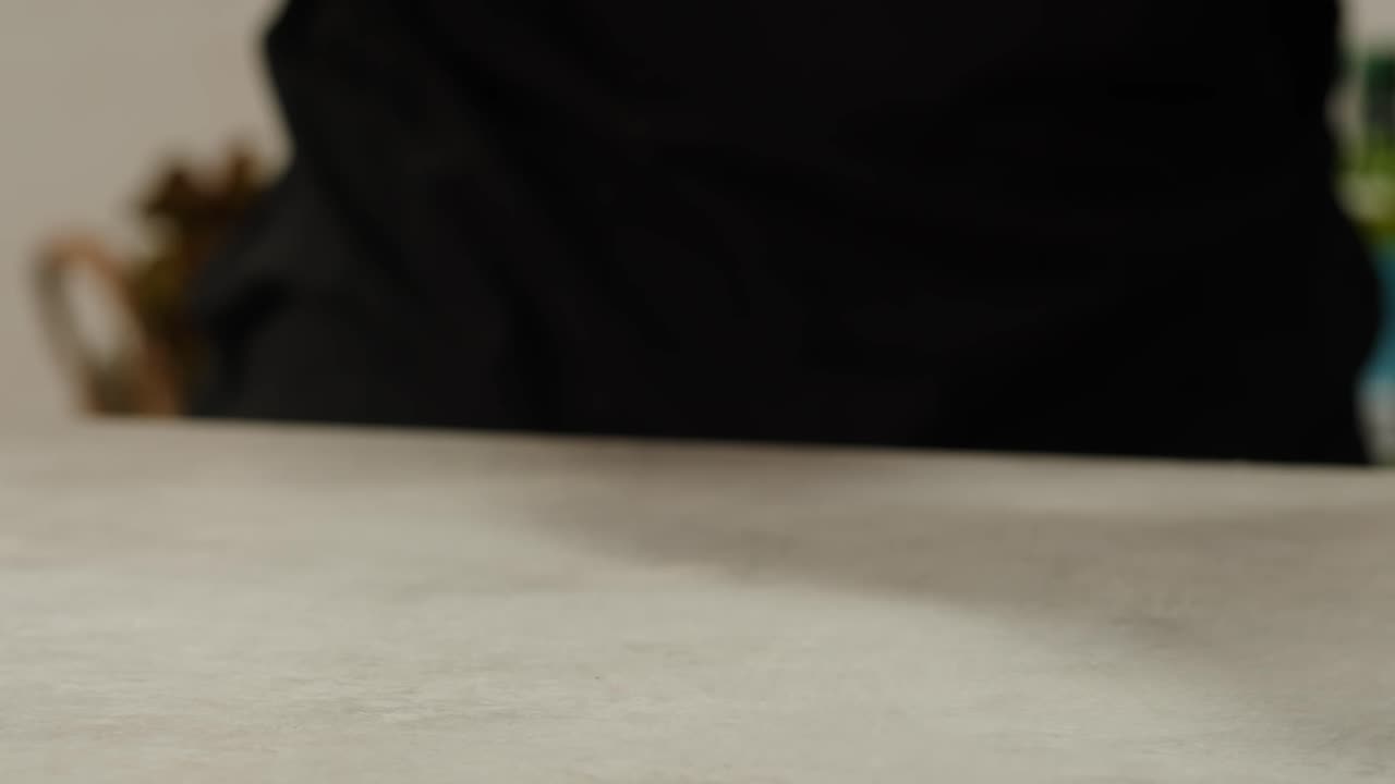 Cutting fresh green onions on a cutting board, close up chef cooking green vegan salad.