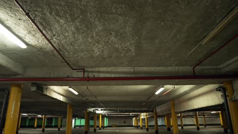 empty underground car park at night, no vehicle in spots in the parking lot