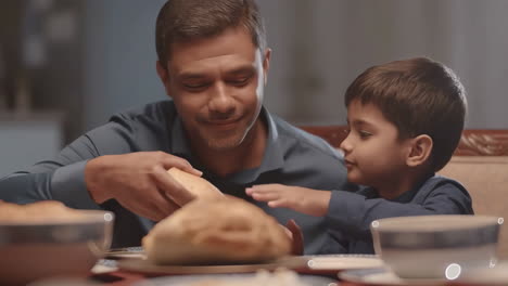 father and son sharing a meal