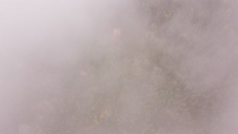 watch tower on top of mountain in clouds