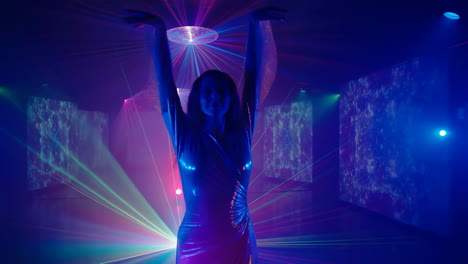 woman dancing in a vibrant laser-lit disco club