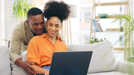 Laptop,-couple-smile-and-relax-in-home-living