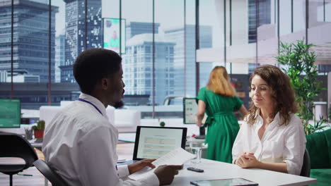 african american hr recruiter interviewing female candidate for a vacancy