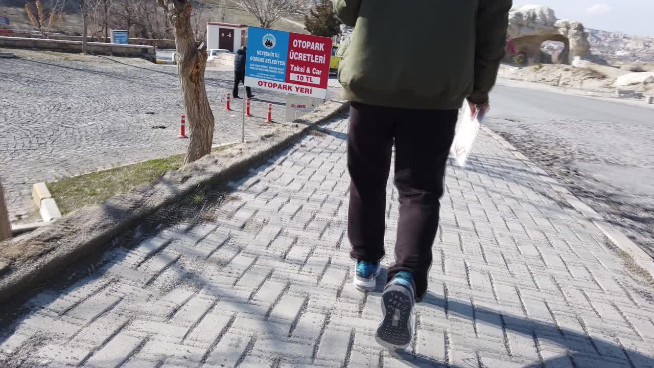 Person Walking on a Stone Path in Cappadocia, Turkey