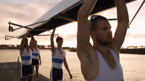 Male-rower-team-carrying-the-boat-on-their-shoulders