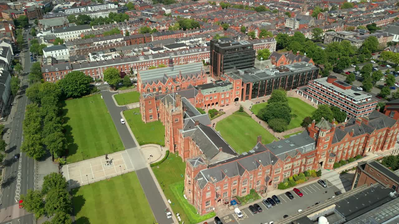 Forward travelling adjacent aerial video of Queen's University Belfast, in Northern Ireland, UK on a bright and sunny day. Produced at 4K resolution, 60FPS and with Rec709 color.