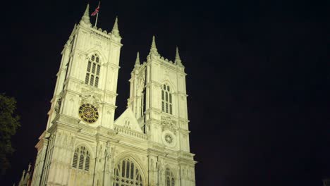 static shot of westminster abbey in westminster, london in the united kingdom. filmed at night, the towers of the abbey sit to the right of the frame. produced in 4k, 50fps with rec709 color space.