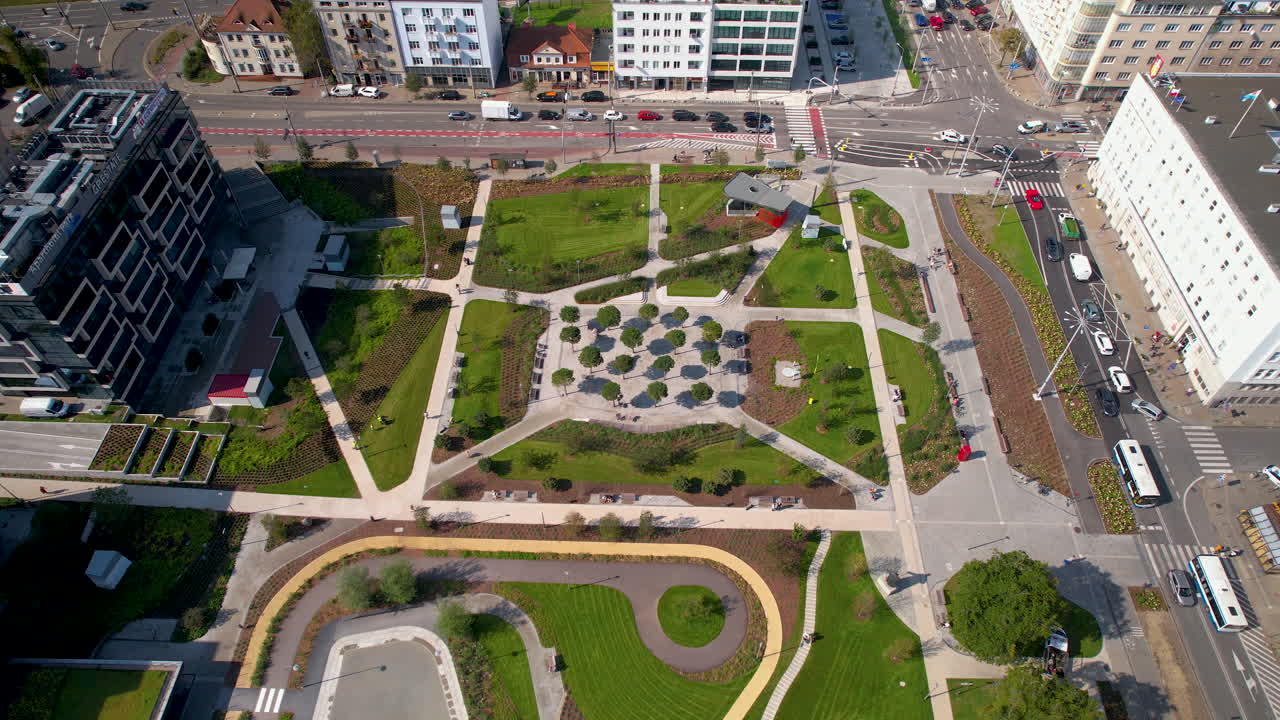 Aerial over Park Centralny in Gdynia, Poland, revealing a stunning city park surrounded by traffic