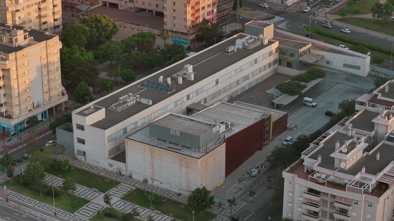 aerial view of modern public building among urban residential blocks in portugal