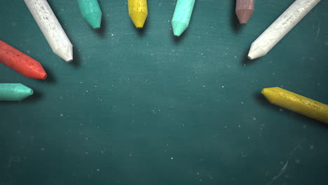 Closeup-colorful-chalk-on-blackboard-school-background-2