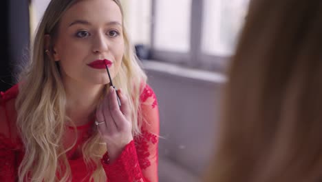 woman applying makeup