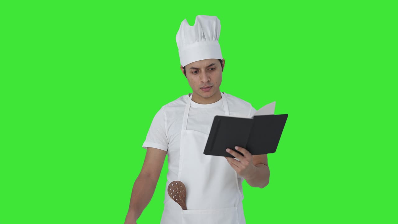 Chef cuisinier indien professionnel confus préparant de la nourriture Écran vert