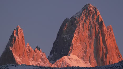 orange-red morning light illuminates mount fitz roy in patagonia