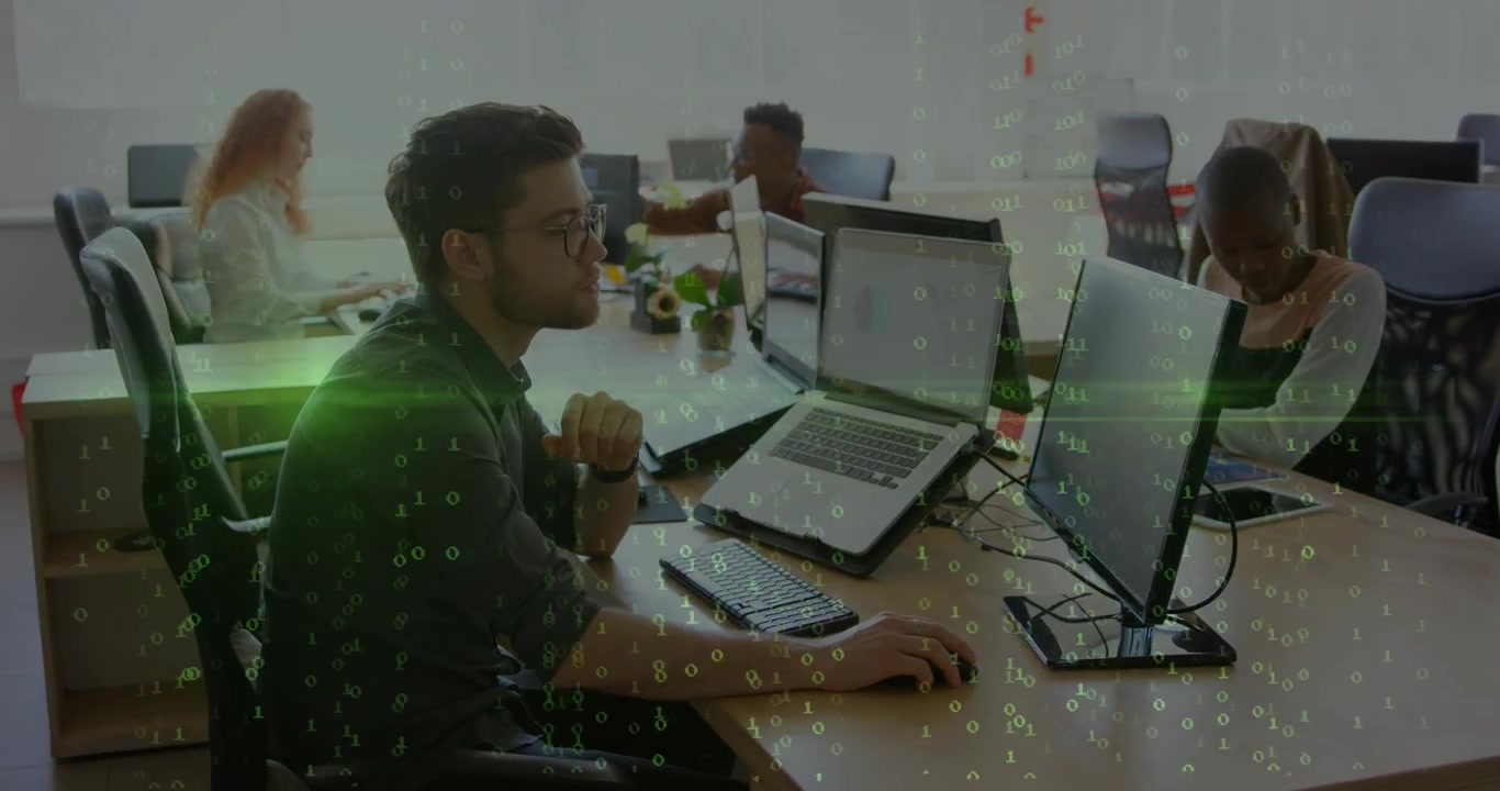 Green code appearing and rising, causing man leaning and typing on laptop handling business data