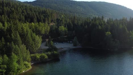 Drone-shot-natural-forest-and-blue-lake-environment,-British-Columbia-Canada