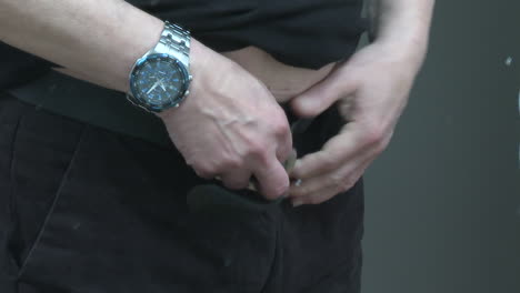 Man Putting on Pants